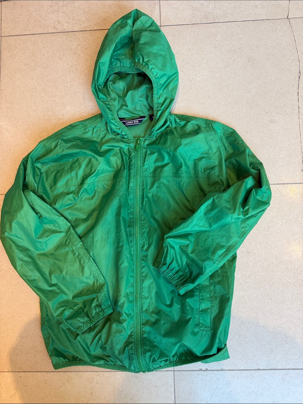 Land’s End Waterproof hooded sackable rain jacket.  Green, size M (10-12).